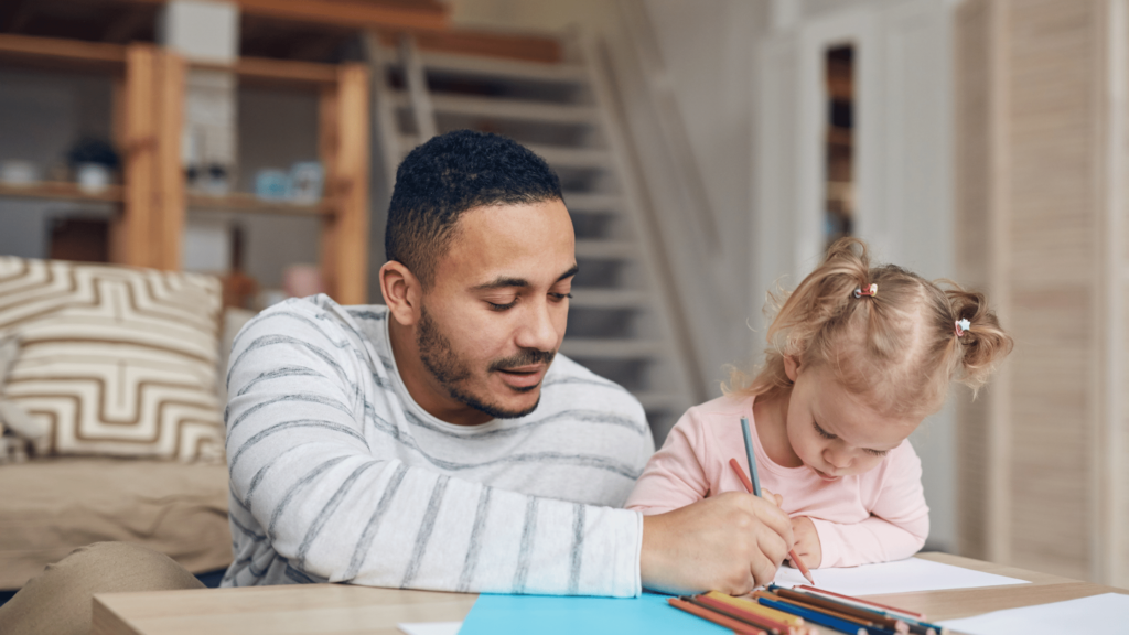 stay at home father helping his child