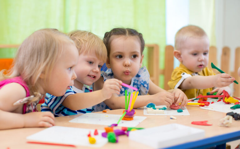 kids group making arts and crafts at daycare