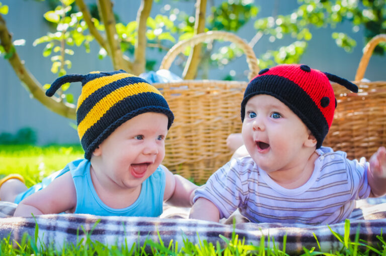 infant twins enjoying the summer at daycare