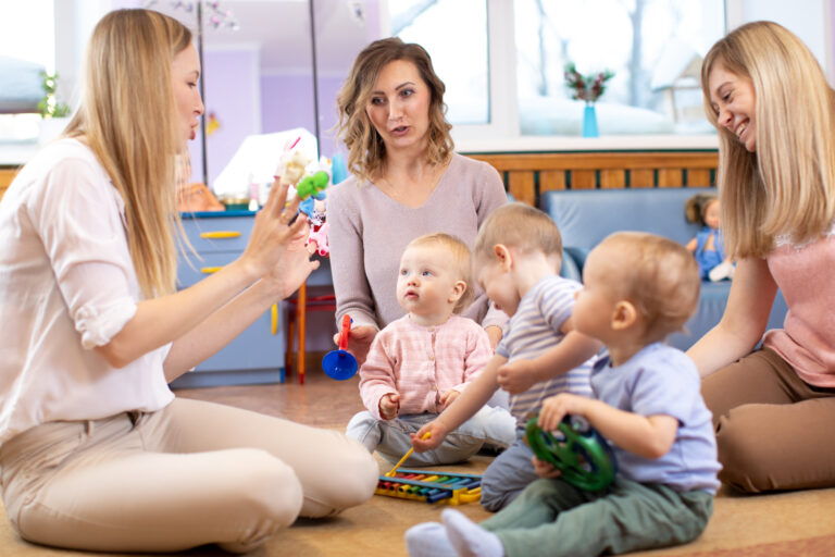 1 years old babies play with educational toys in daycare