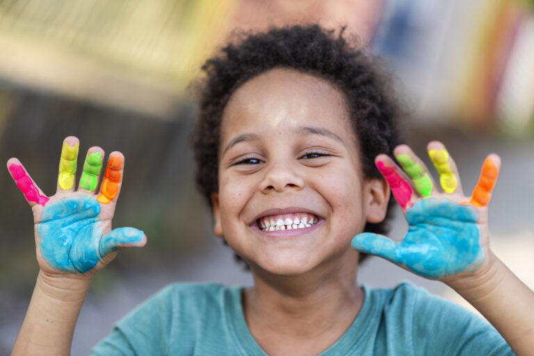 3 year old boy with painted hands