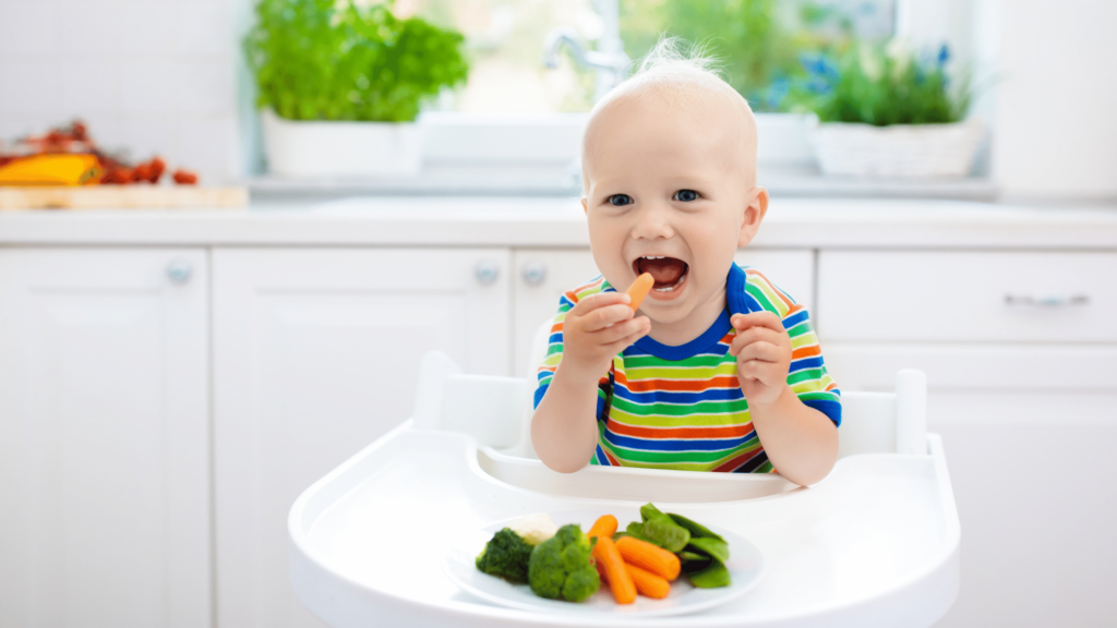 a young toddler eating healthy vegetables