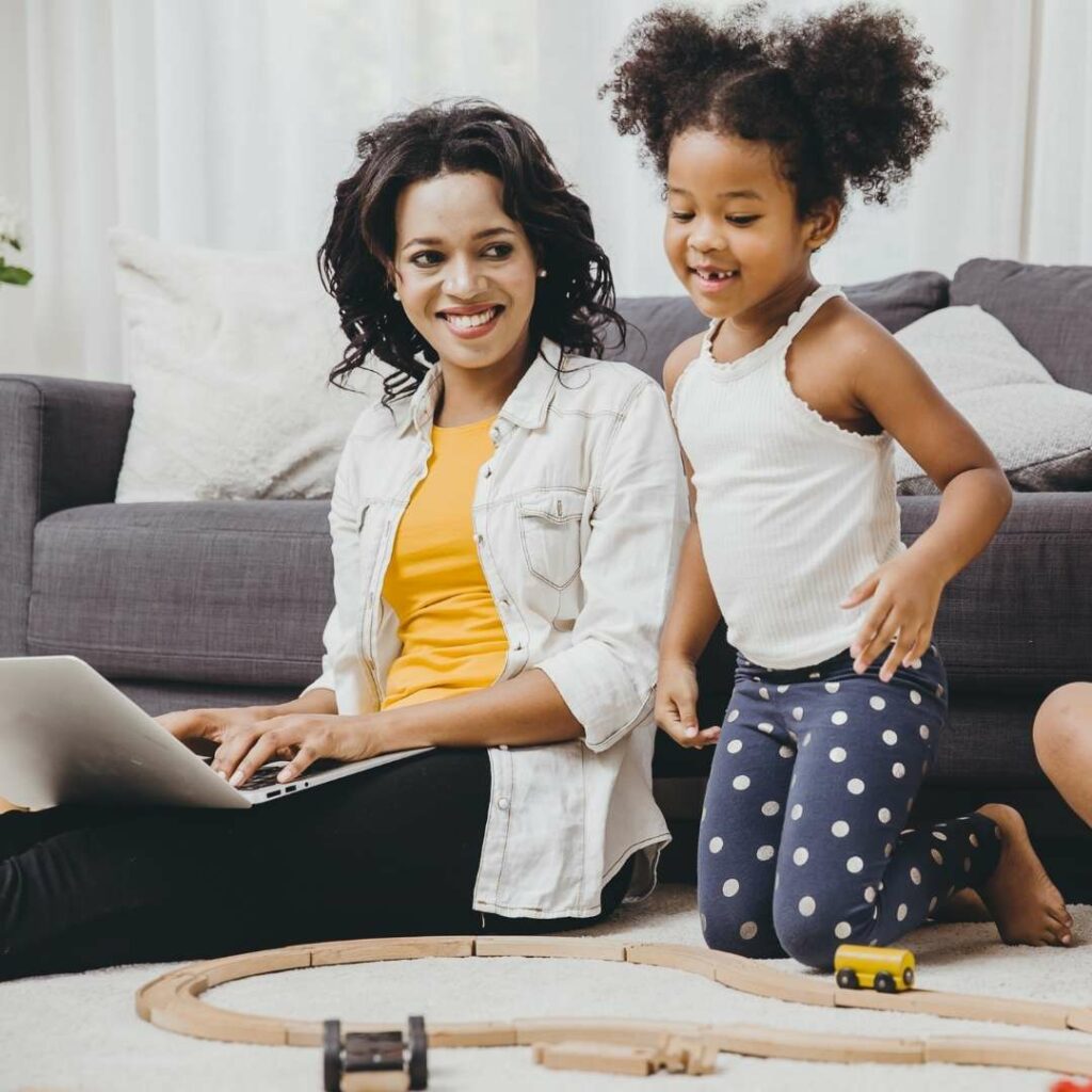 Happy mother and daughter in living room