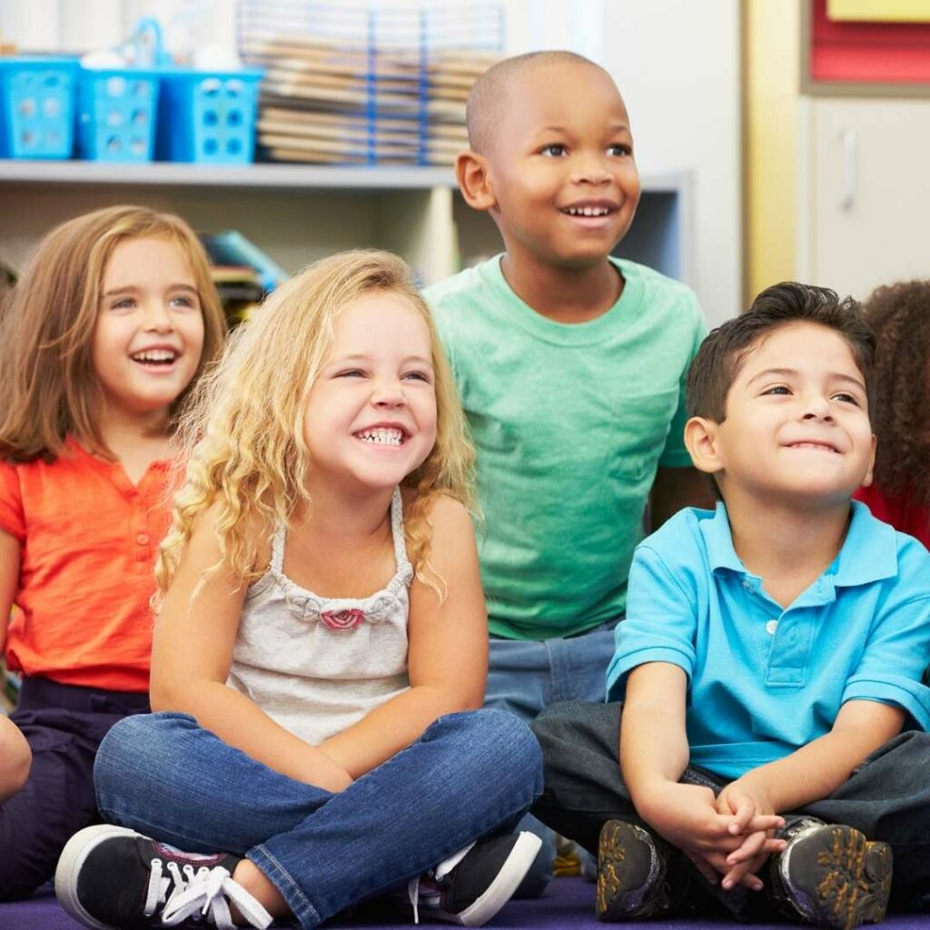 Group of smiling children in a classroom