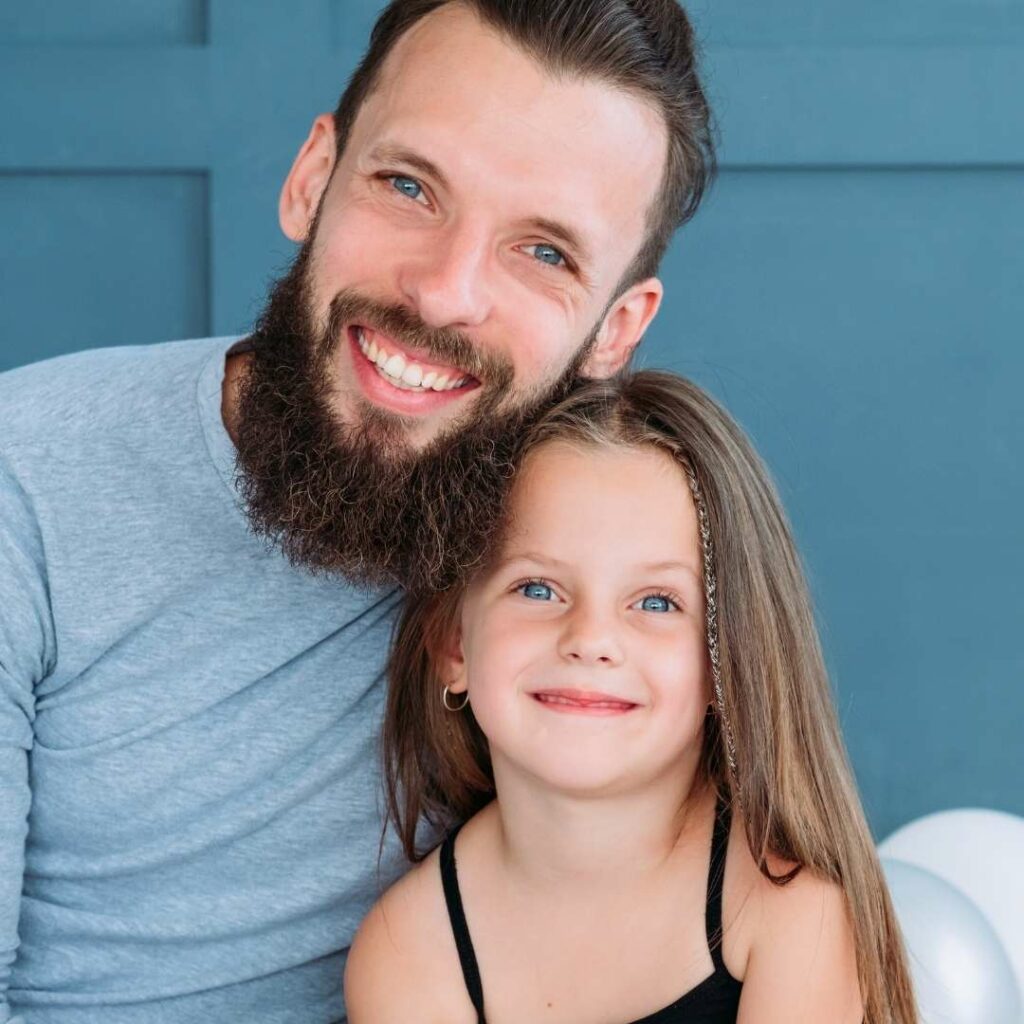 Smiling father and daughter