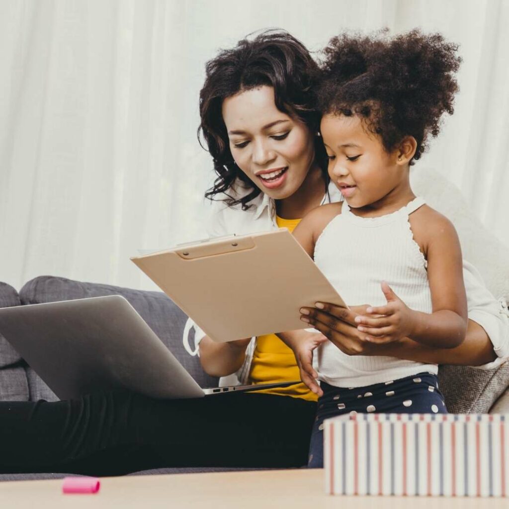 Mother and daughter looking at a document