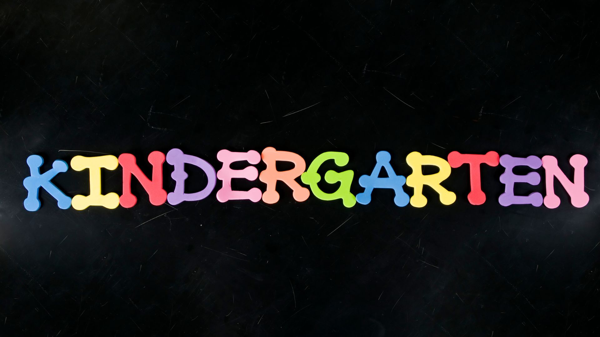 "kindergarten" spelled with knobby foam letters