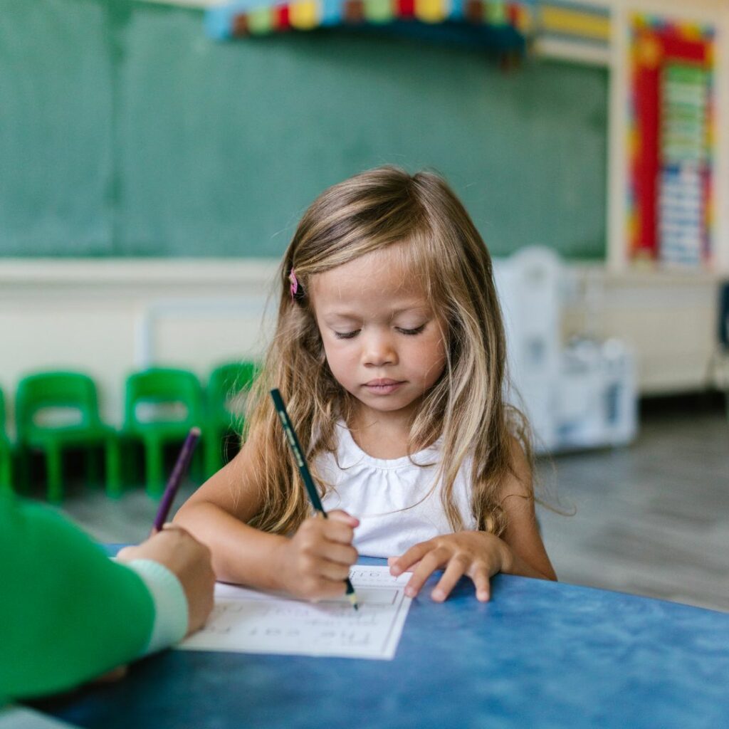 Young girl working on school work. 